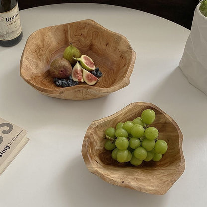 Organic wooden bowls in natural wood tones with an irregular shape