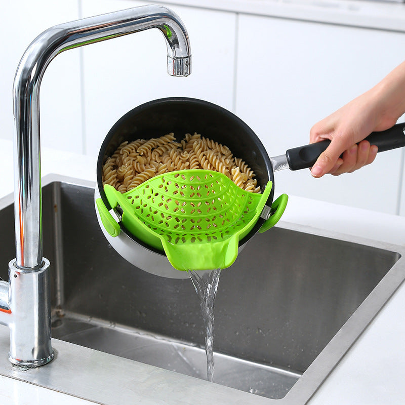Green silicone clip-on pot strainer for eco-friendly kitchen use