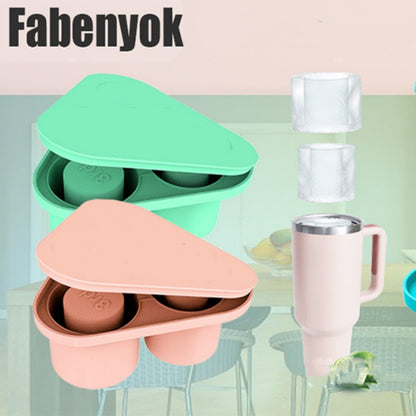 Green and pink triangular silicone ice cube tray with round compartments