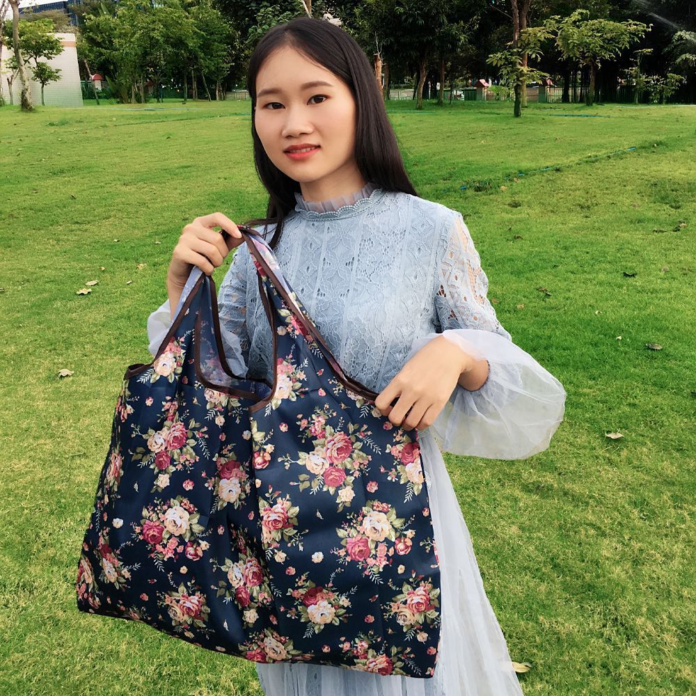 Dark blue floral reusable shopping bag for groceries