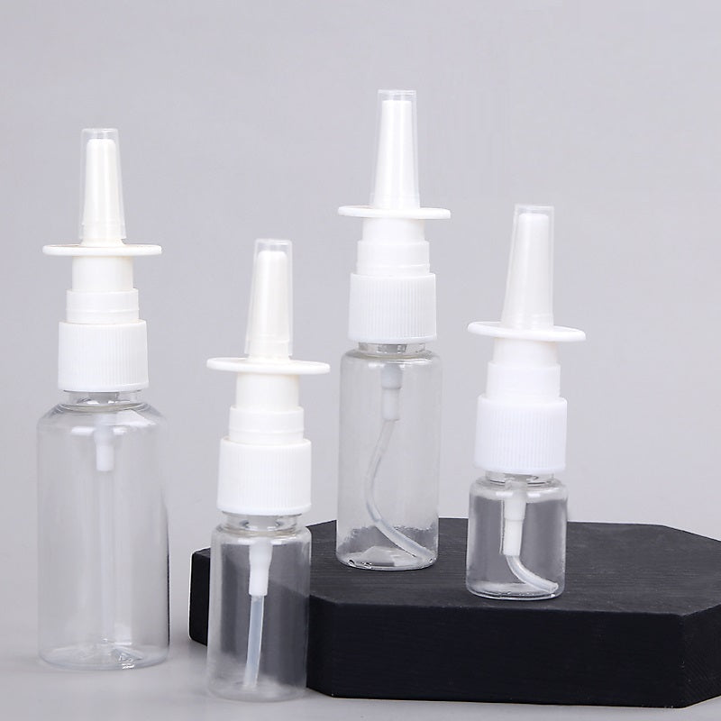 Clear refillable spray bottles with white nozzles for eco-friendly travel