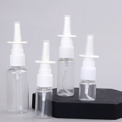 Clear refillable spray bottles with white nozzles for eco-friendly travel