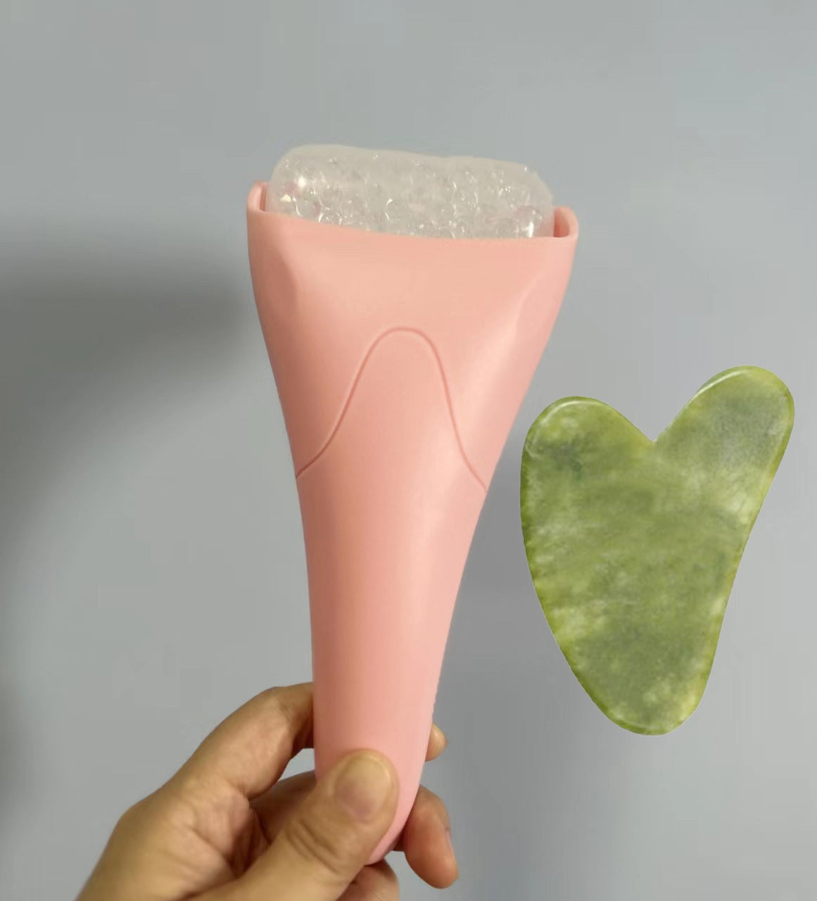 Pink Ergonomic Facial Ice Roller for Skincare and Wellness