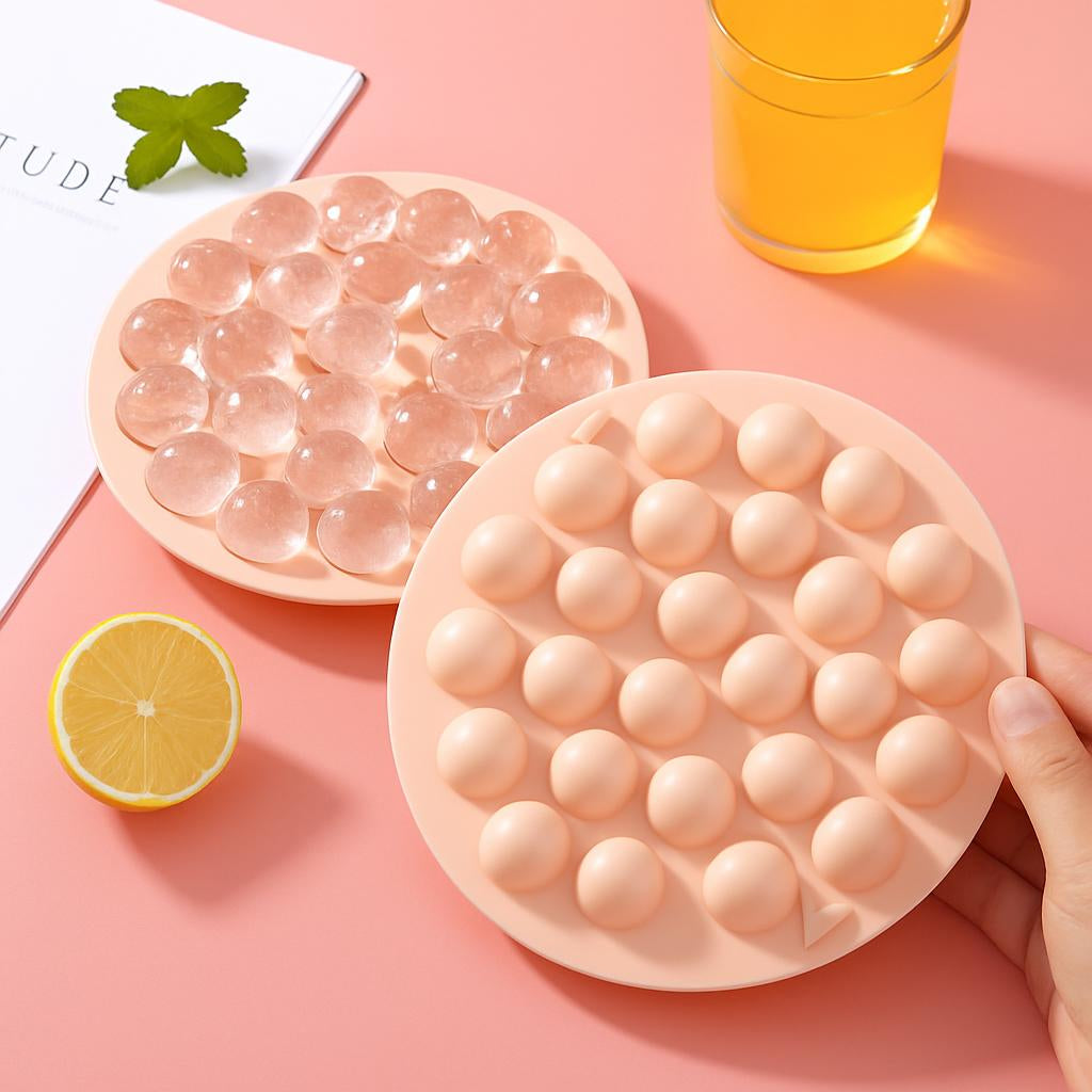 Circular silicone ice cube tray in light pink with dome-shaped compartments