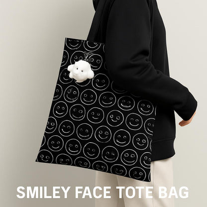 Black tote bag with white smiley face pattern