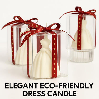 White dress-shaped decorative candle in clear box with red ribbon