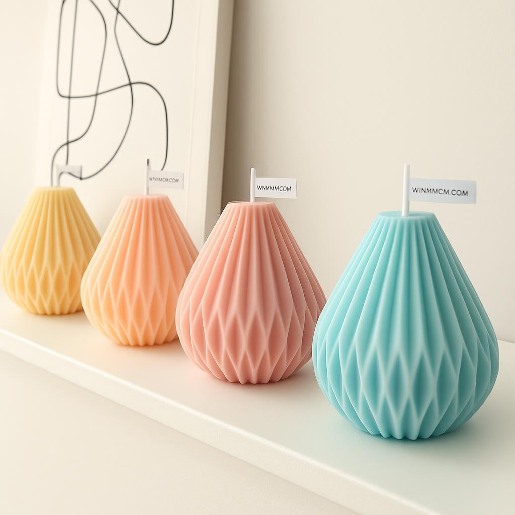 Geometric pastel handmade candles in blue, pink, and beige with a faceted surface