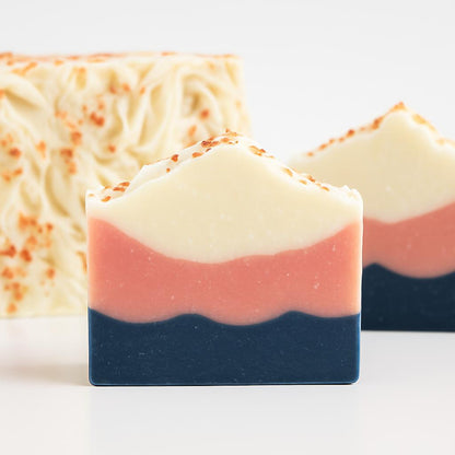 Multicolored natural bar soap with layers of white, pink, and dark blue