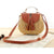 small light  brown with leather straw bag